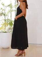 Vestido midi negro de cintura baja con cuello halter